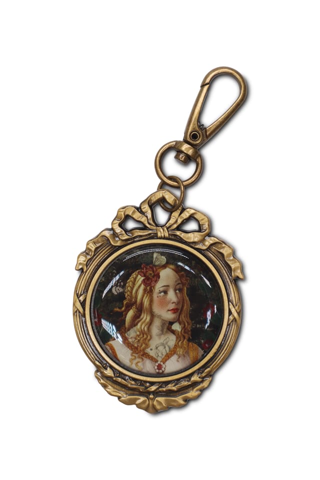 Porte-clefs médaillon Extase · Porte-clefs médaillon Extase