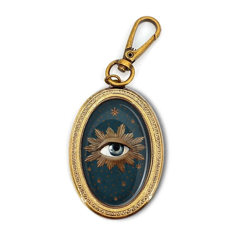 PORTE CLEFS OEIL SACRE
